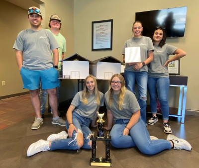 students with winning poultry house model