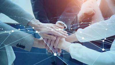 Business people's hands together in teamwork